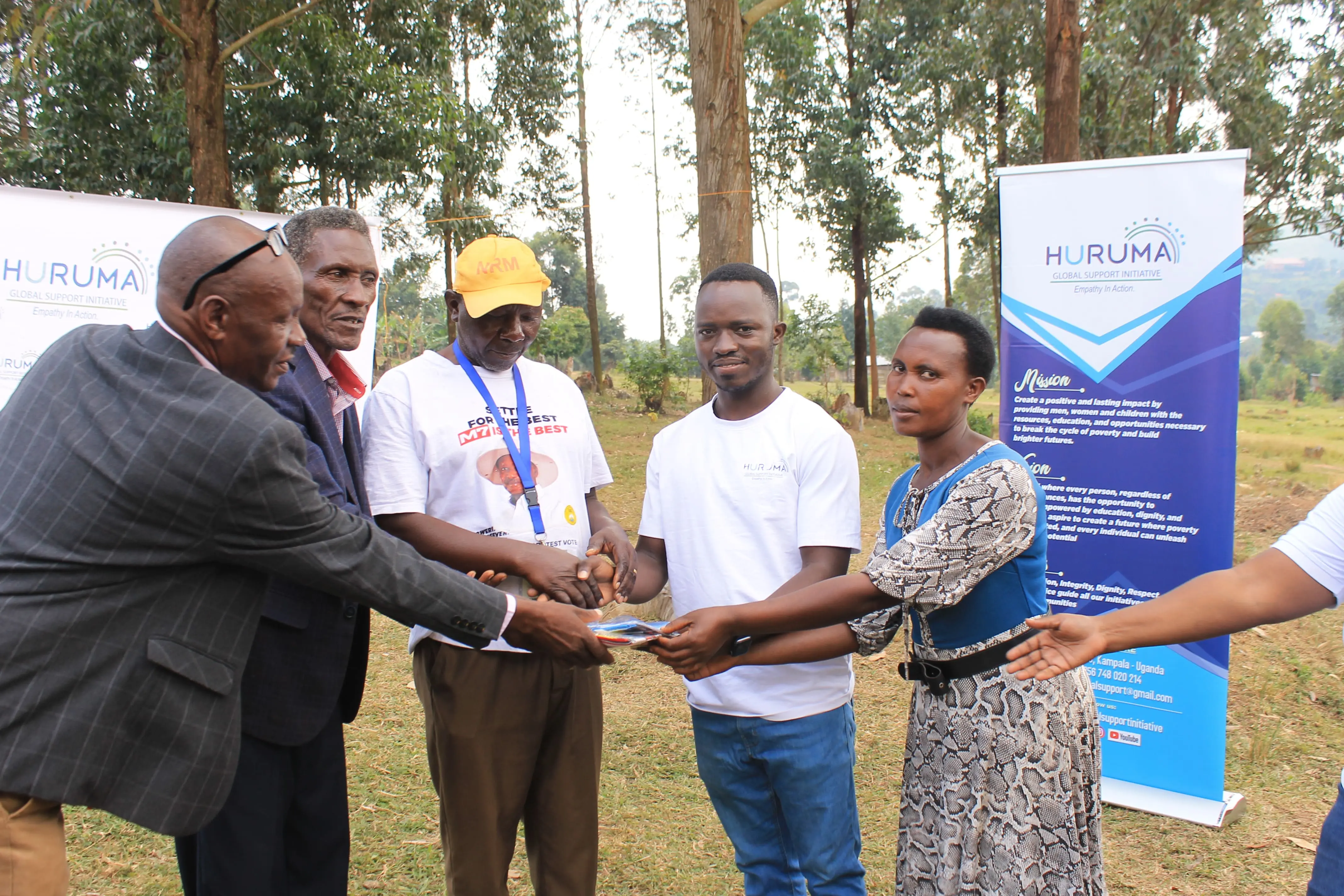 Huruma representatives handing over support to a school community